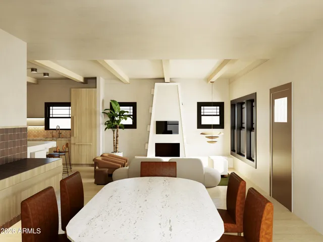 a living room with furniture a flat screen tv and kitchen view