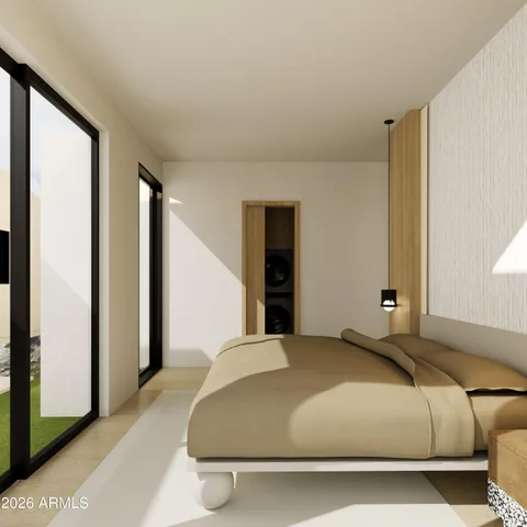 a bedroom with a large bed and a large window