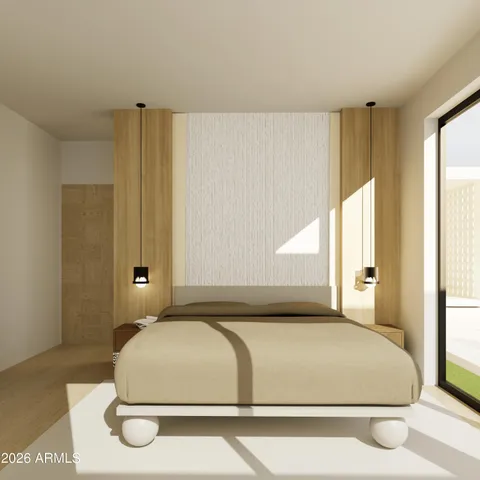a bedroom with a bed and a large window
