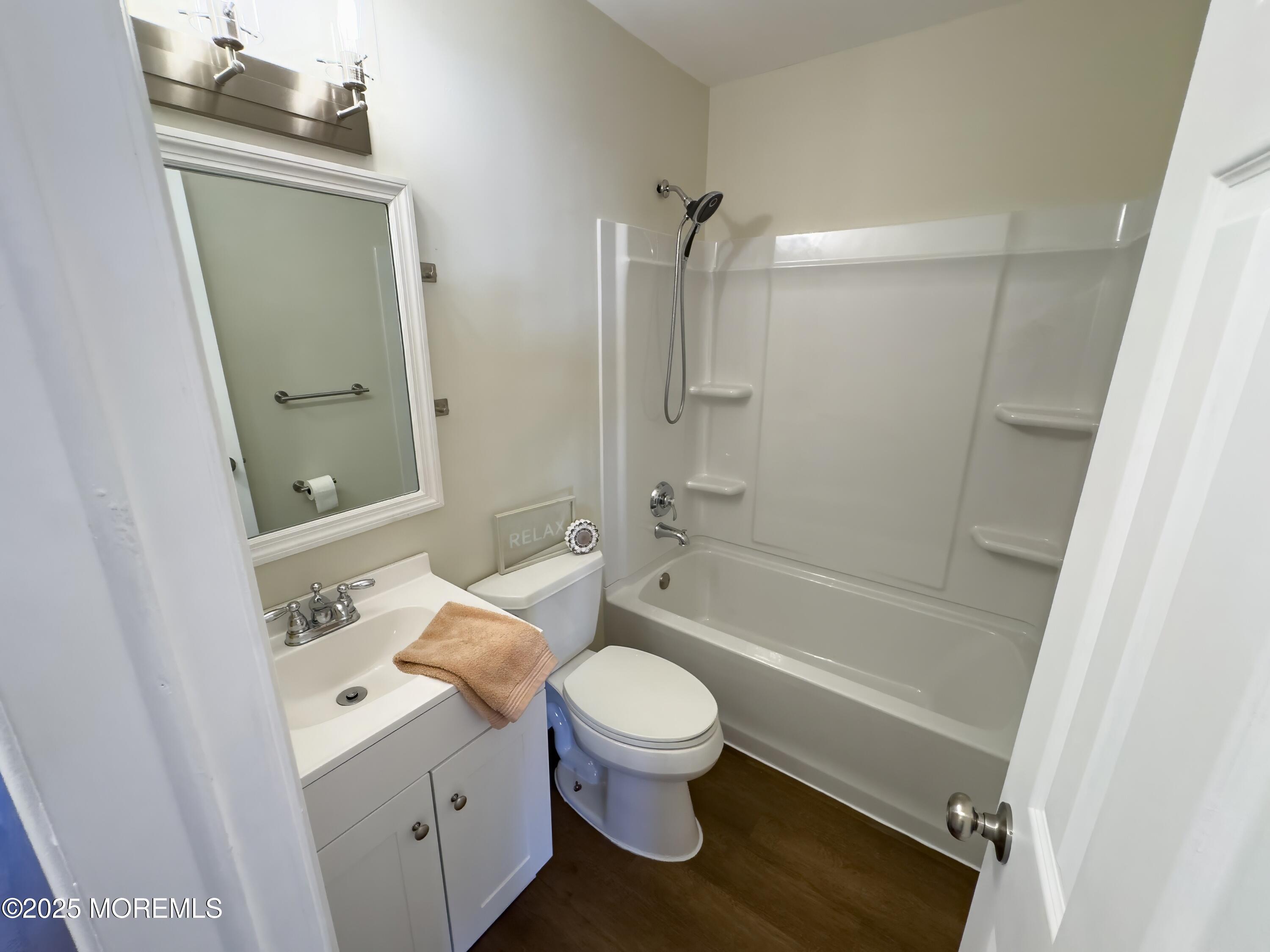 30 Bryant Drive Jackson, NJ 08527 - Photo 17 of 58 a bathroom with a granite countertop toilet a sink and a bathtub
