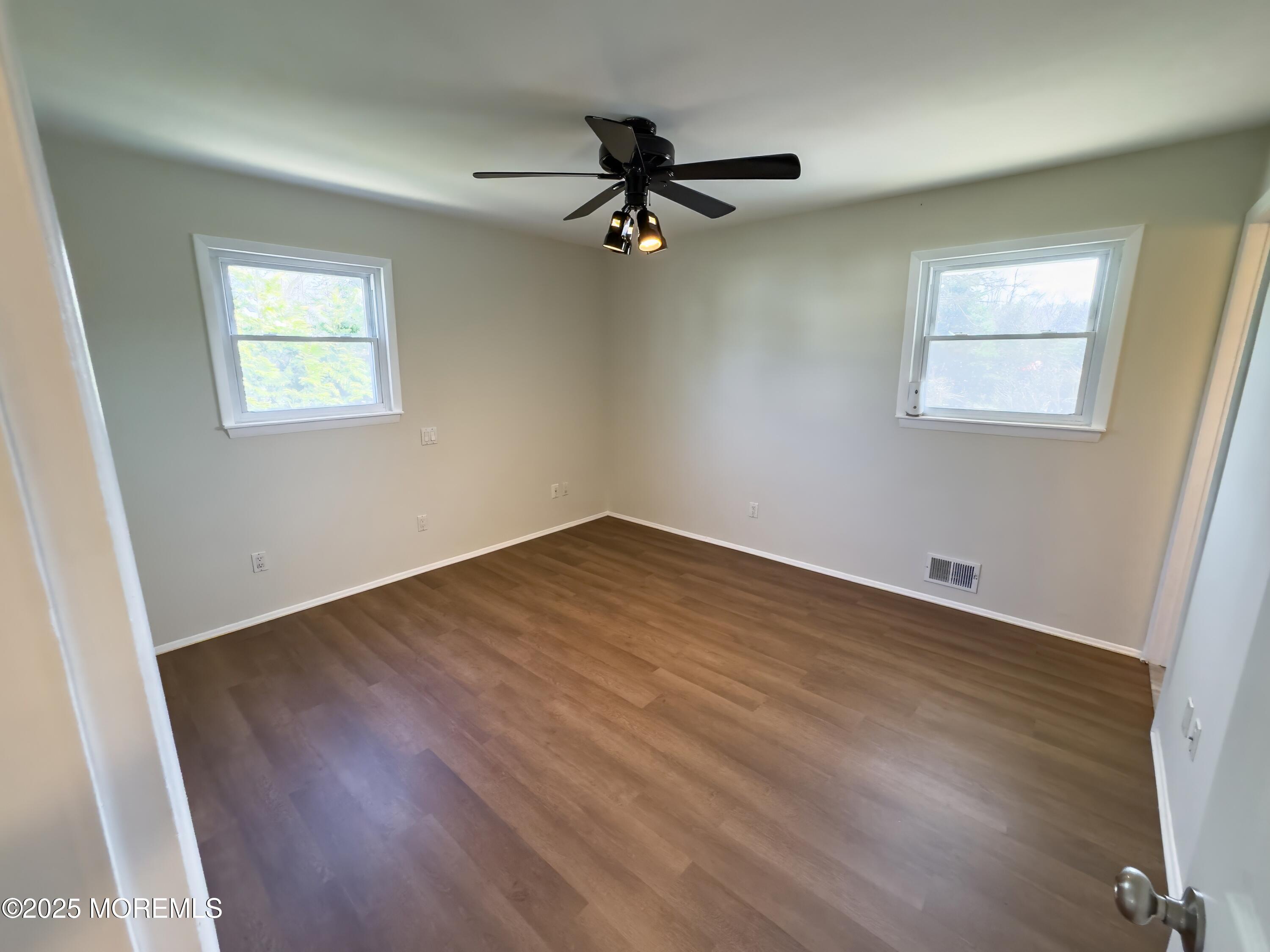 30 Bryant Drive Jackson, NJ 08527 - Photo 22 of 58 a view of empty room with wooden floor