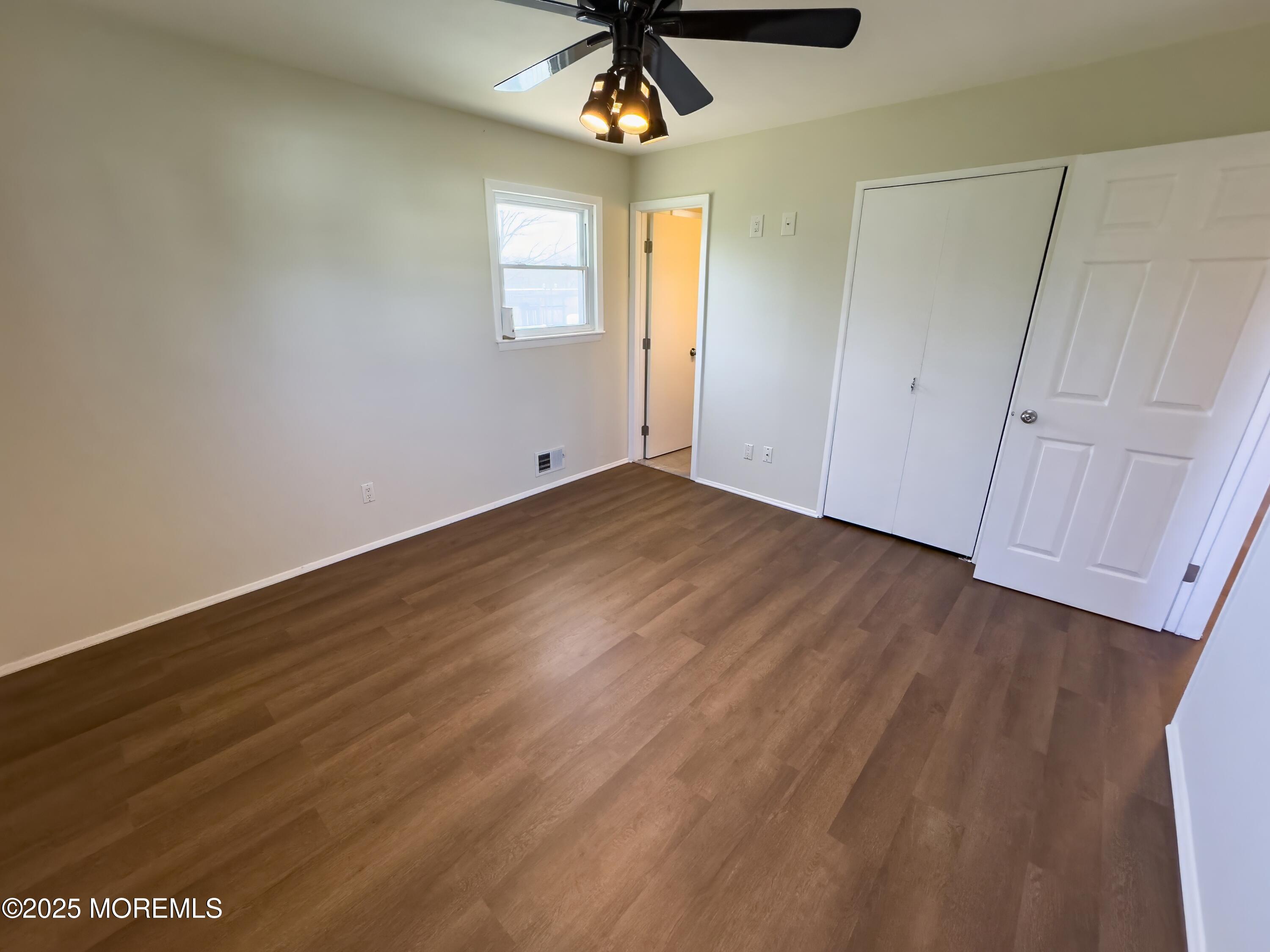 30 Bryant Drive Jackson, NJ 08527 - Photo 24 of 58 wooden floor in an empty room with a window