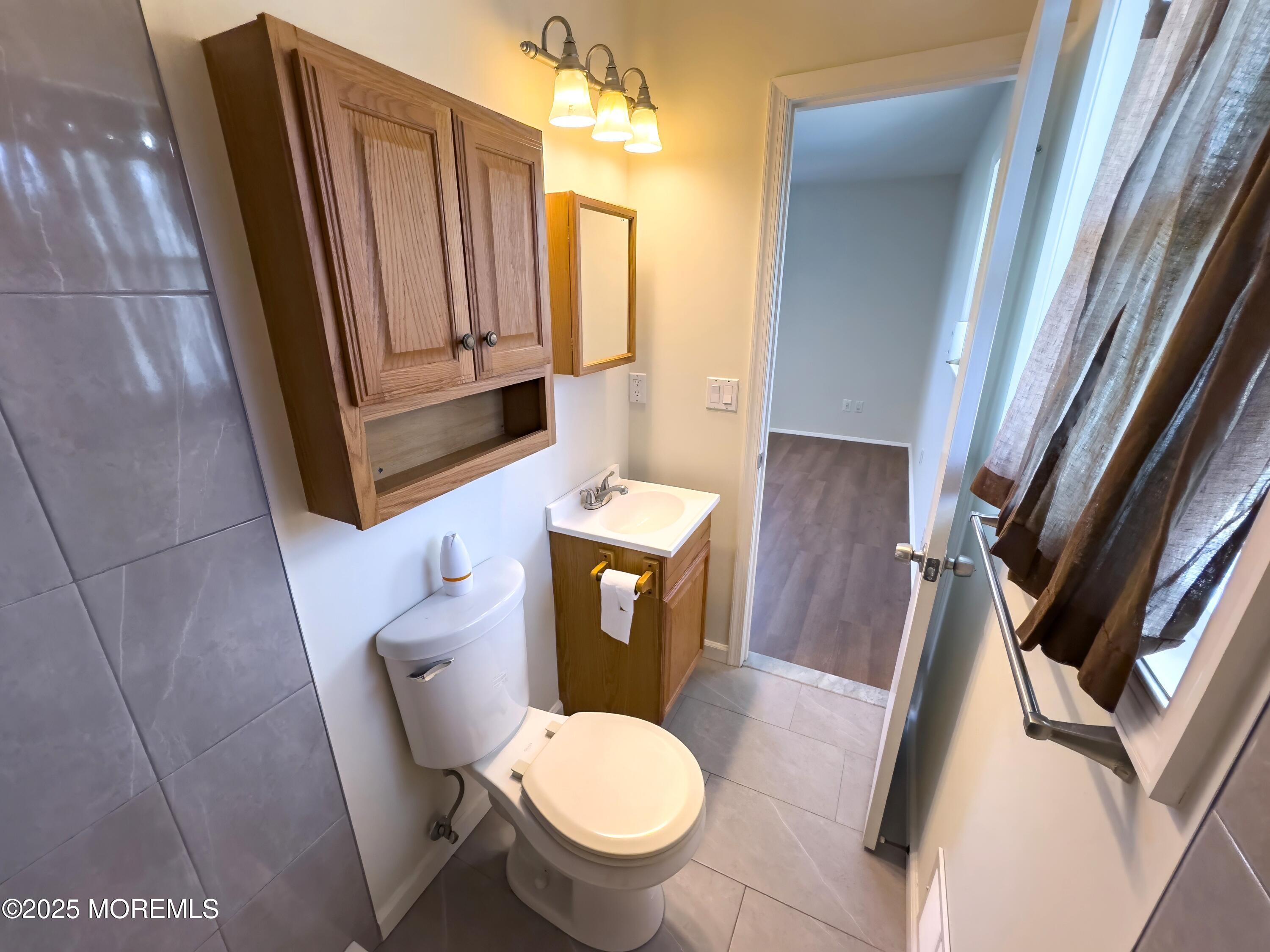 30 Bryant Drive Jackson, NJ 08527 - Photo 26 of 58 a toilet sitting in a bathroom next to a sink