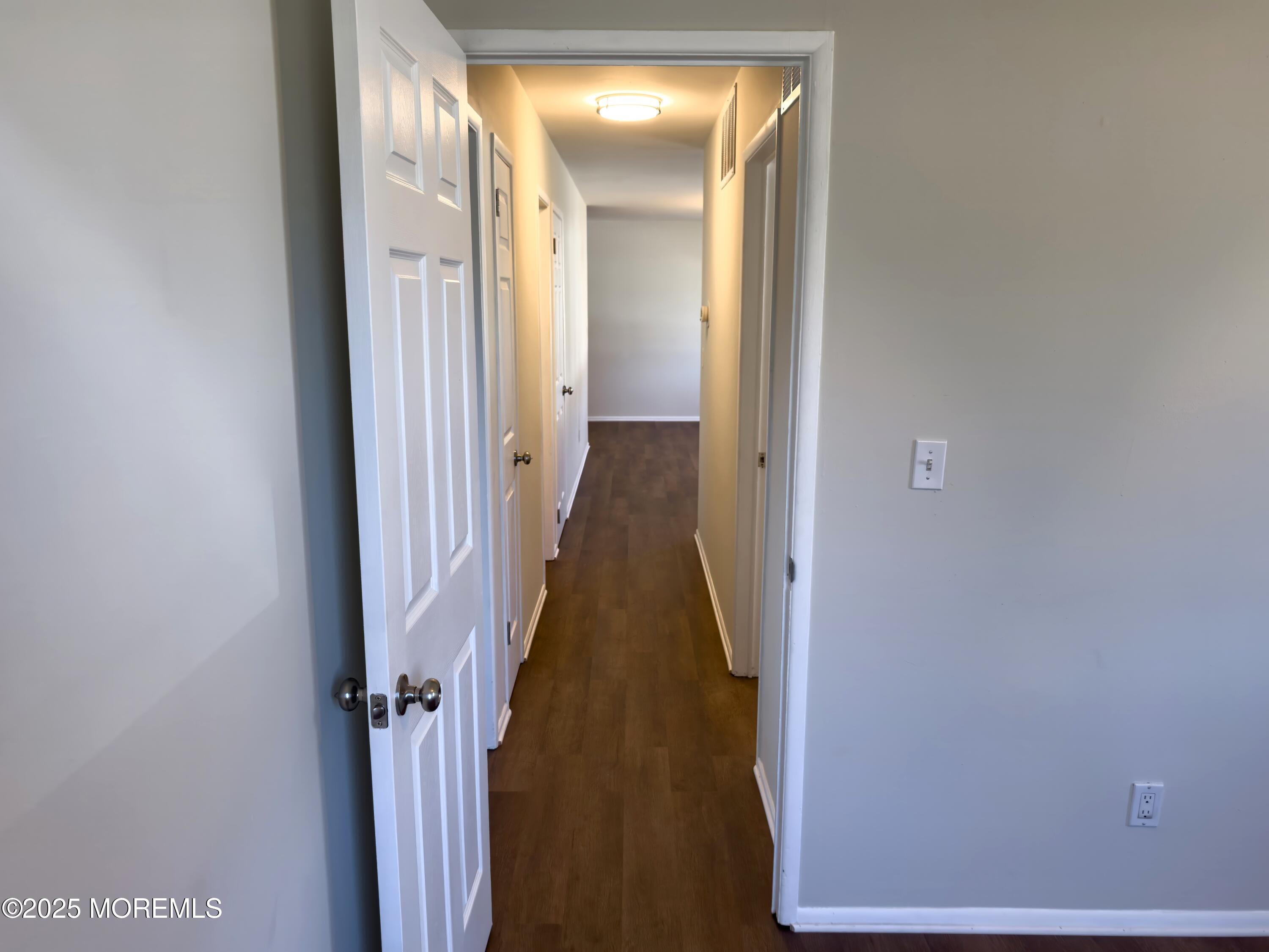30 Bryant Drive Jackson, NJ 08527 - Photo 28 of 58 a view of a hallway with wooden floor and closet