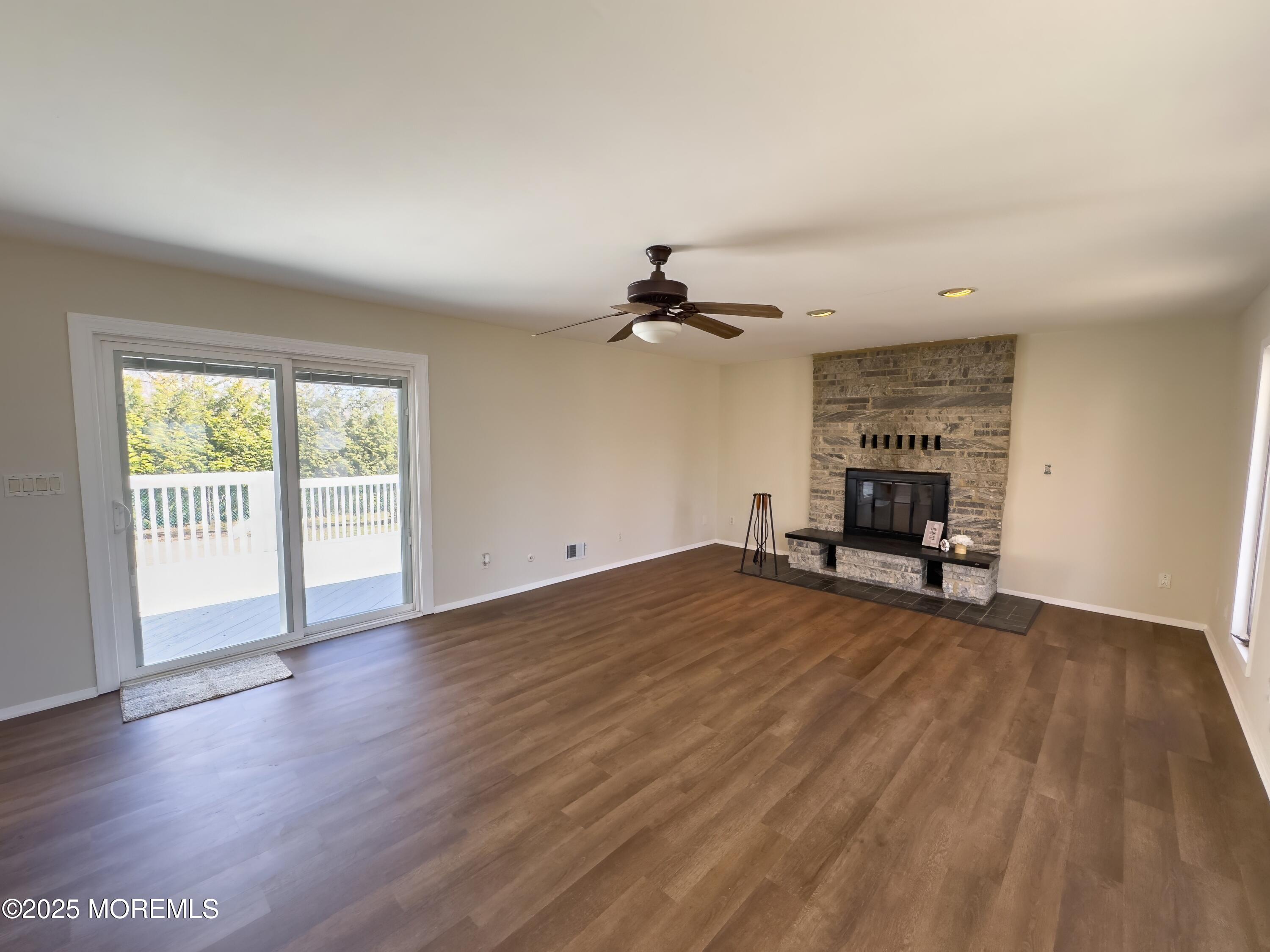 30 Bryant Drive Jackson, NJ 08527 - Photo 29 of 58 a view of empty room with wooden floor and fan