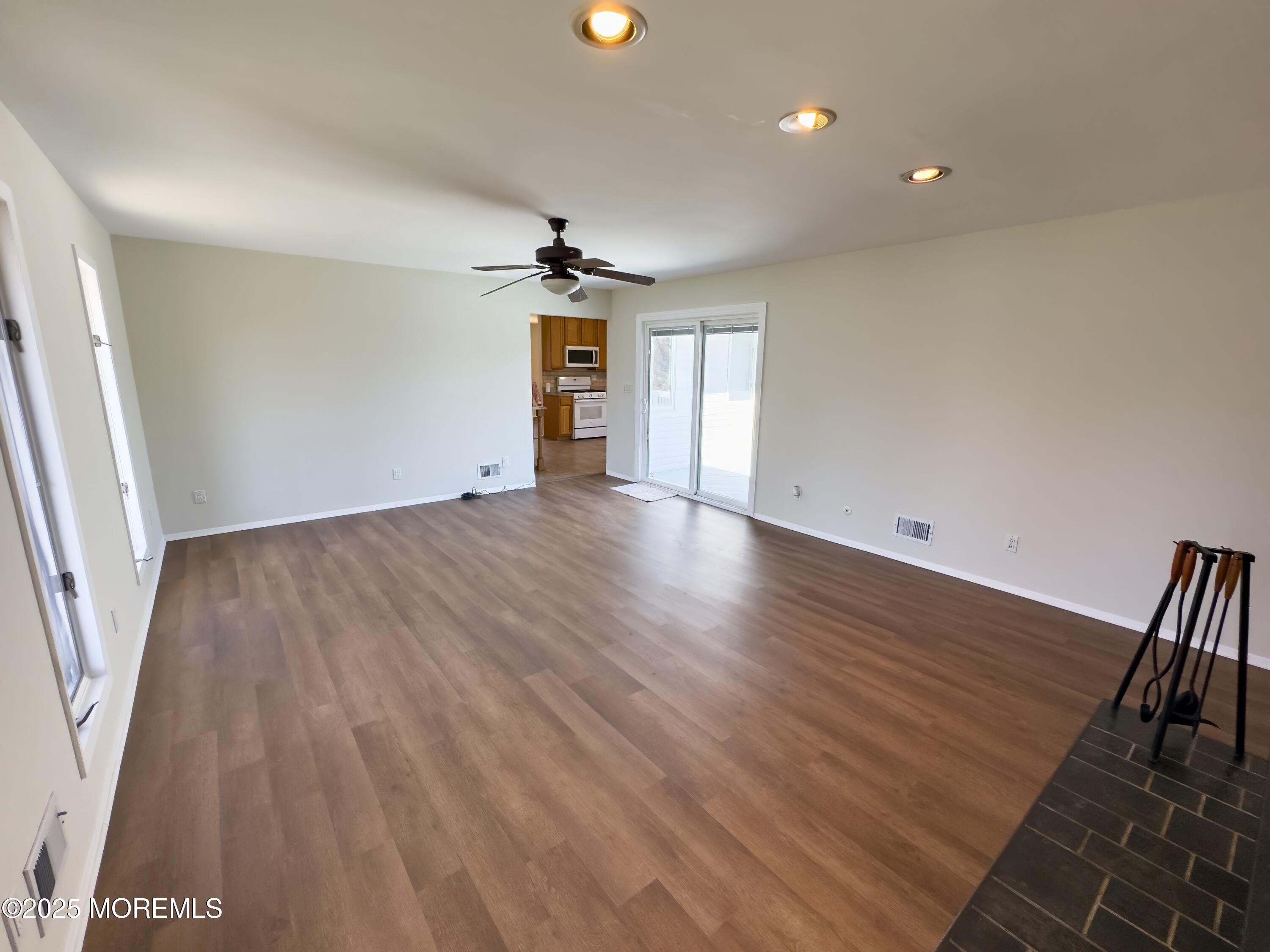 30 Bryant Drive Jackson, NJ 08527 - Photo 31 of 58 wooden floor in an empty room with a window