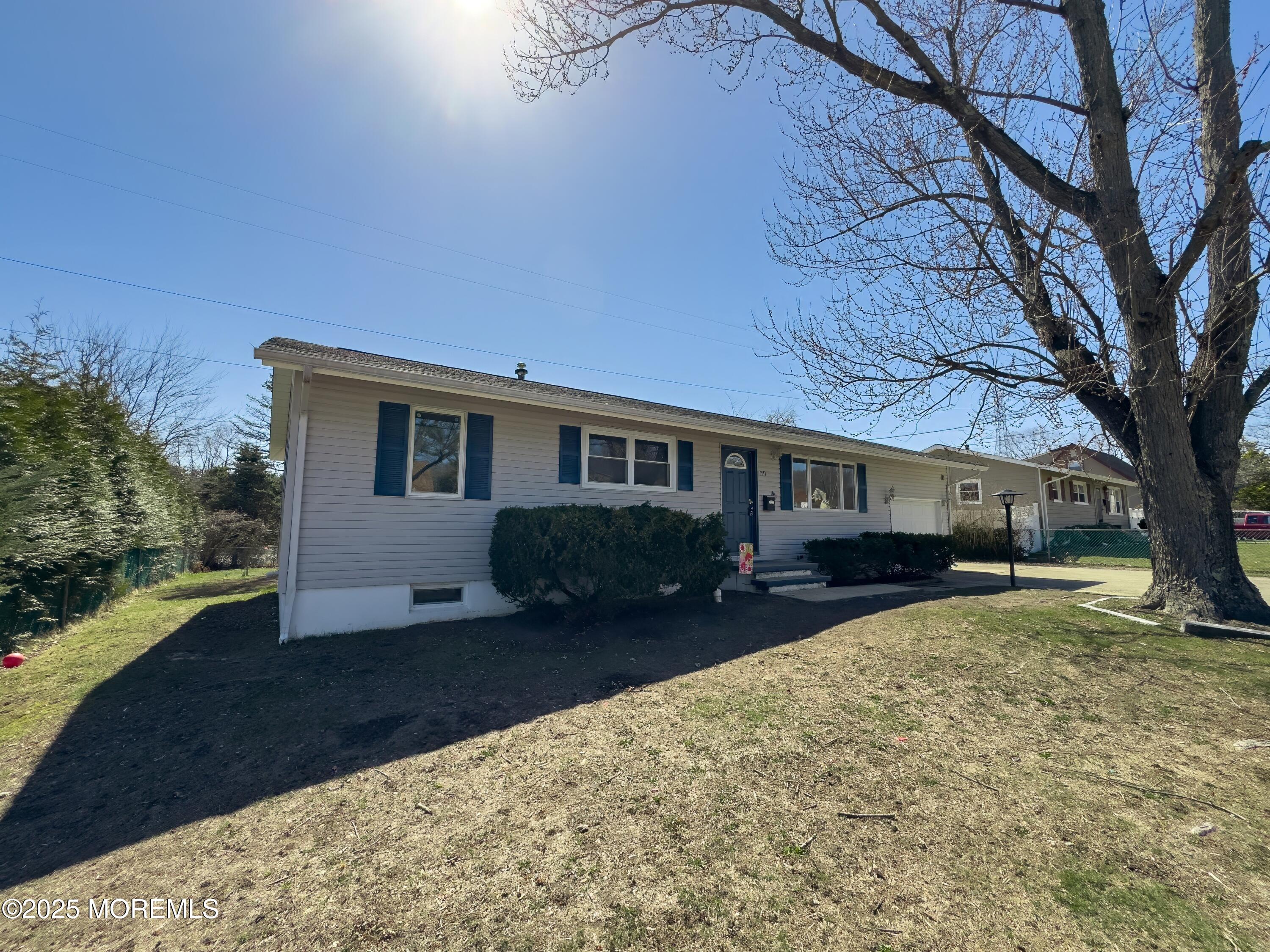 30 Bryant Drive Jackson, NJ 08527 - Photo 4 of 58 a view of a house with a yard covered in snow