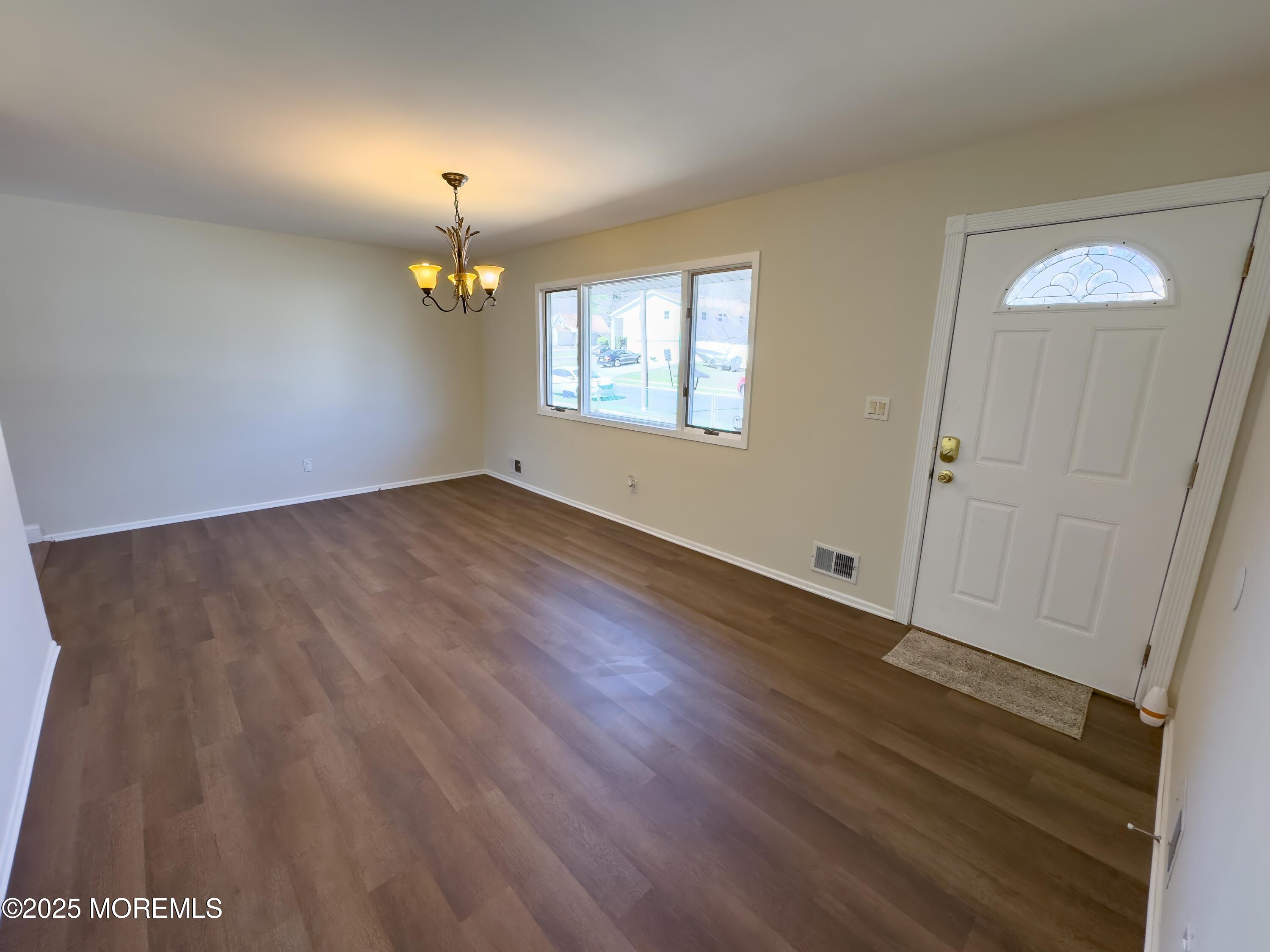 30 Bryant Drive Jackson, NJ 08527 - Photo 8 of 58 wooden floor in an empty room with a window