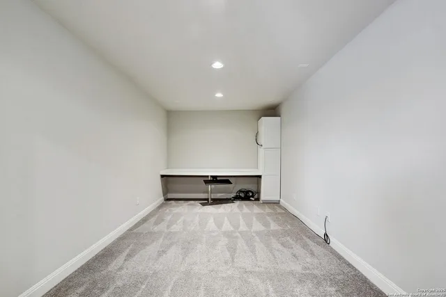 a view of outdoor space with wooden floor