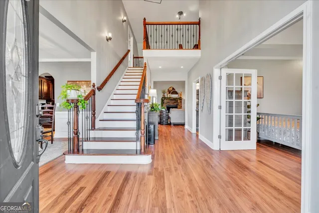 a bedroom with furniture and a rug
