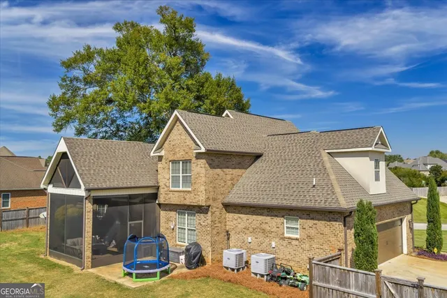 an aerial view of a house with a porch