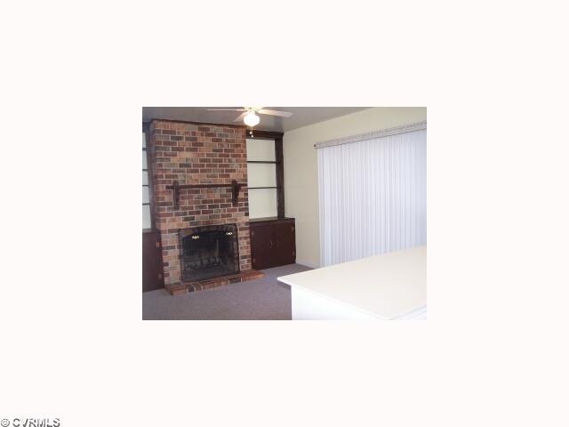 10052 Purcell Road Henrico, VA 23228 - Photo 3 of 10 Dining Room - 10052 Purcell Road - Dining Room with Masonry Fireplace & Sliding Glass Door