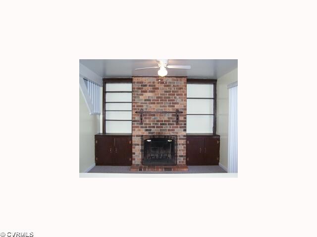10052 Purcell Road Henrico, VA 23228 - Photo 4 of 10 Interior Space/Layout - 10052 Purcell Road - Masonry Woodburning Fireplace with Wood Mantle, Built-in Bookcases & Cabinets
