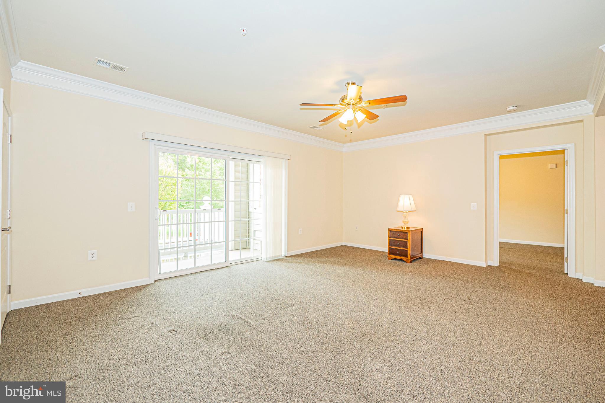 1405 Wigeon Way, Unit 206 Gambrills, MD 21054 - Photo 12 of 29 a view of an empty room with a window