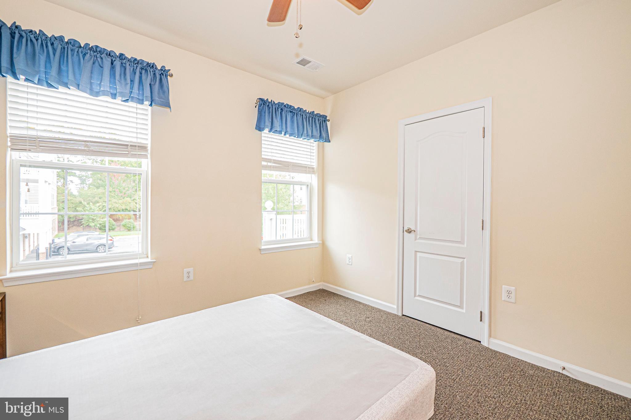 1405 Wigeon Way, Unit 206 Gambrills, MD 21054 - Photo 21 of 29 a big room with windows and closet