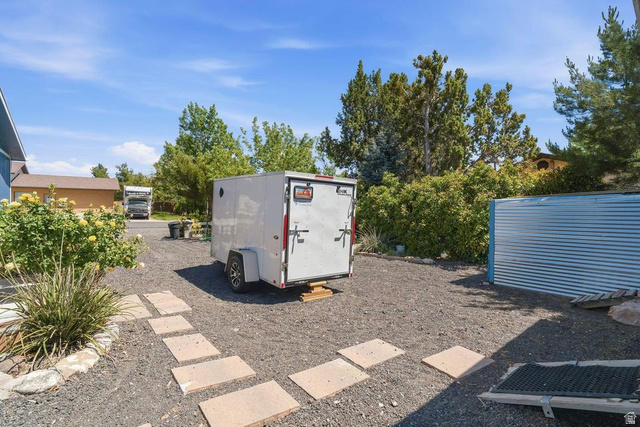 327 North Lodge Road Central, UT 84722 - Photo 37 of 45 Gravel yard with stepping stone pathway and mature landscaping