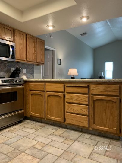 807 James Street Ridgecrest, CA 93555 - Photo 12 of 37 a kitchen with a sink and cabinets