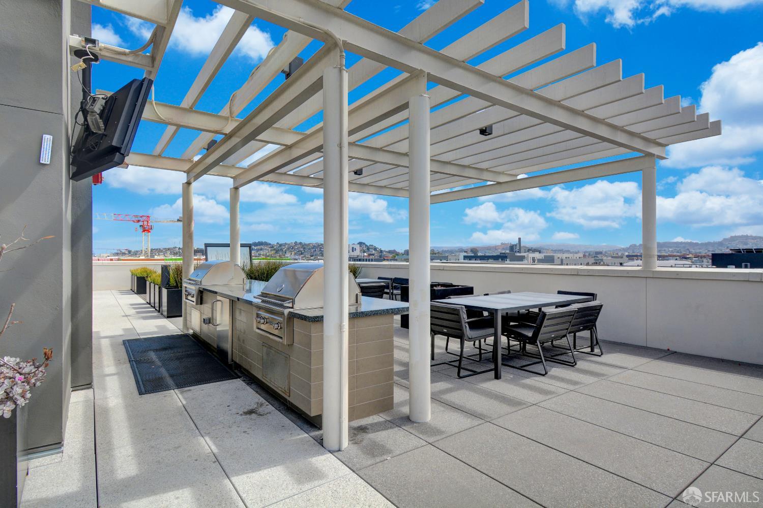 99 Rausch Street, Unit 303 San Francisco, CA 94103 - Photo 18 of 37 a view of a patio with a table and chairs