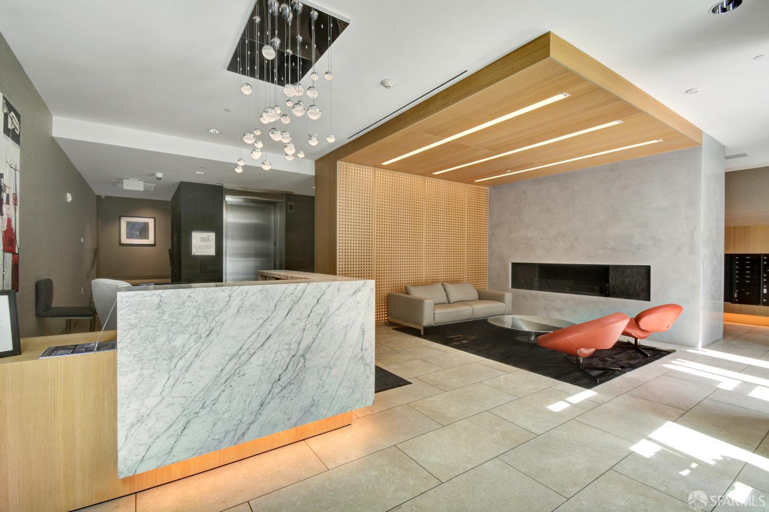 99 Rausch Street, Unit 303 San Francisco, CA 94103 - Photo 32 of 37 a living room with furniture and a chandelier