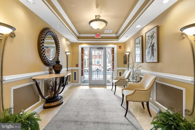 a view of a livingroom with furniture and a large window