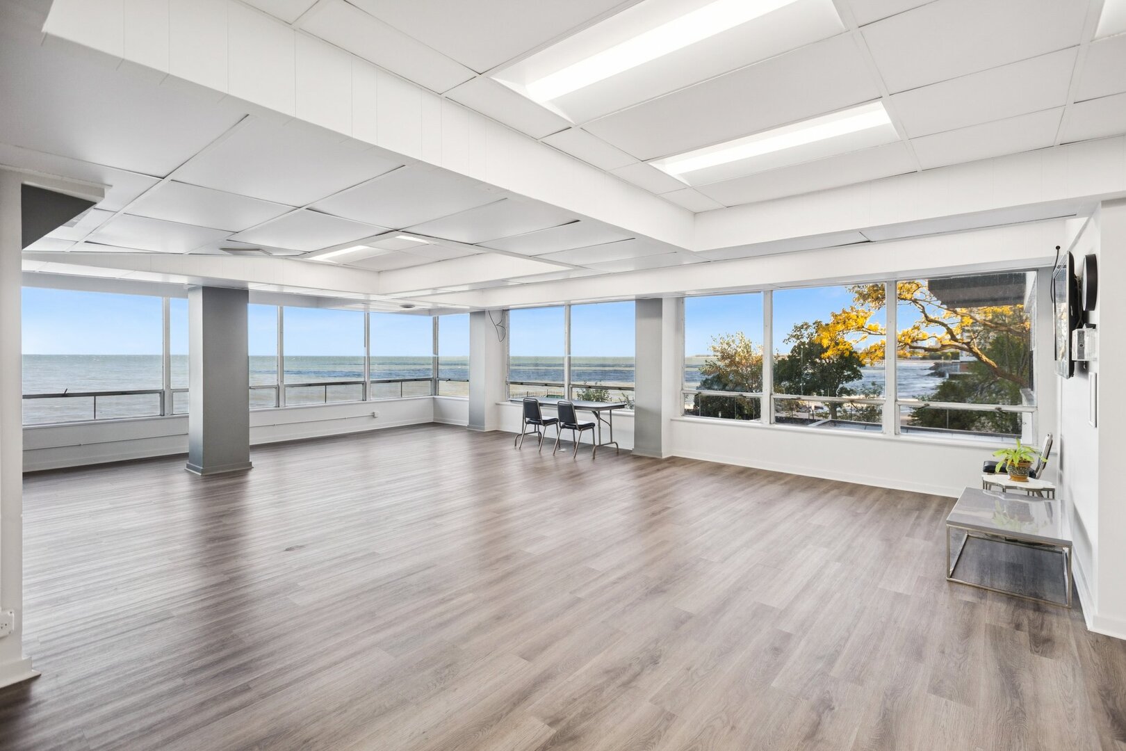 6301 North Sheridan Road, Unit 6K Chicago, IL 60660 - Photo 16 of 21 a view of a livingroom with furniture wooden floor and window