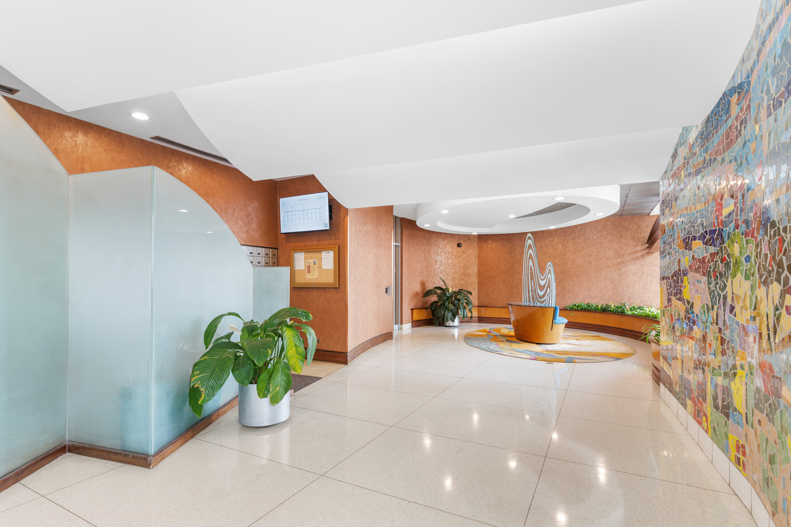 6301 North Sheridan Road, Unit 6K Chicago, IL 60660 - Photo 6 of 21 a view of a lobby with a potted plant