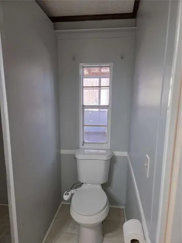 a bathroom with a glass shower door and a sink