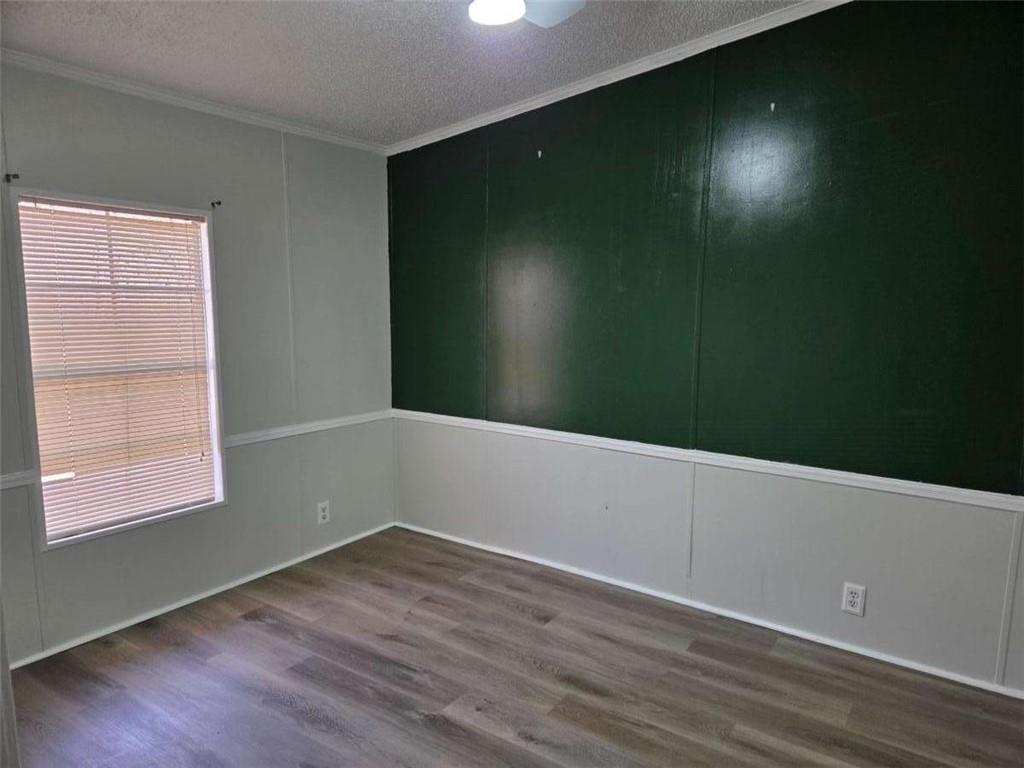 145 Rock Forge Court Jefferson, GA 30549 - Photo 16 of 22 an empty room with wooden floor and windows