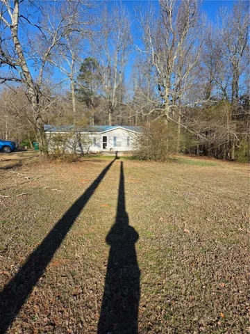 a view of a pathway with a yard