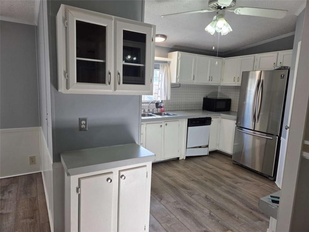 145 Rock Forge Court Jefferson, GA 30549 - Photo 4 of 22 a kitchen with stainless steel appliances a refrigerator sink and cabinets