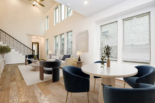 a living room with couches and chairs