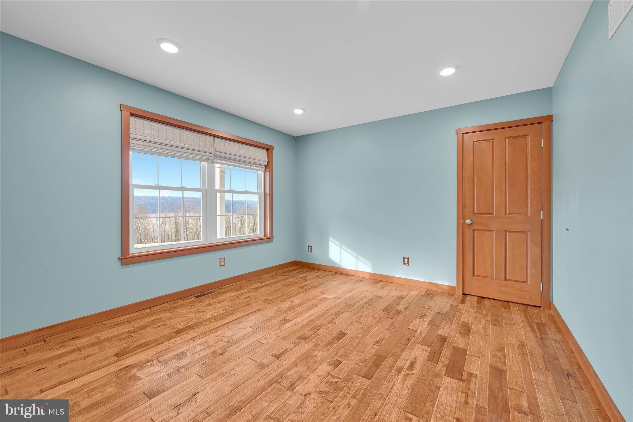 643 Deturksville Road Pine Grove, PA 17963 - Photo 37 of 59 a view of an empty room with wooden floor and a window