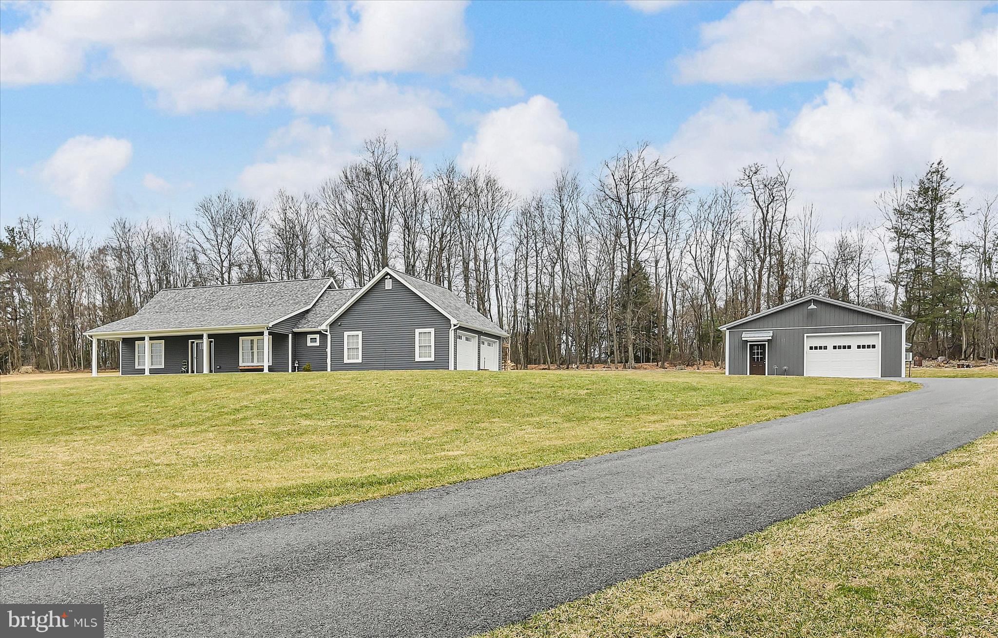 643 Deturksville Road Pine Grove, PA 17963 - Photo 7 of 59 a front view of a house with a yard and garage