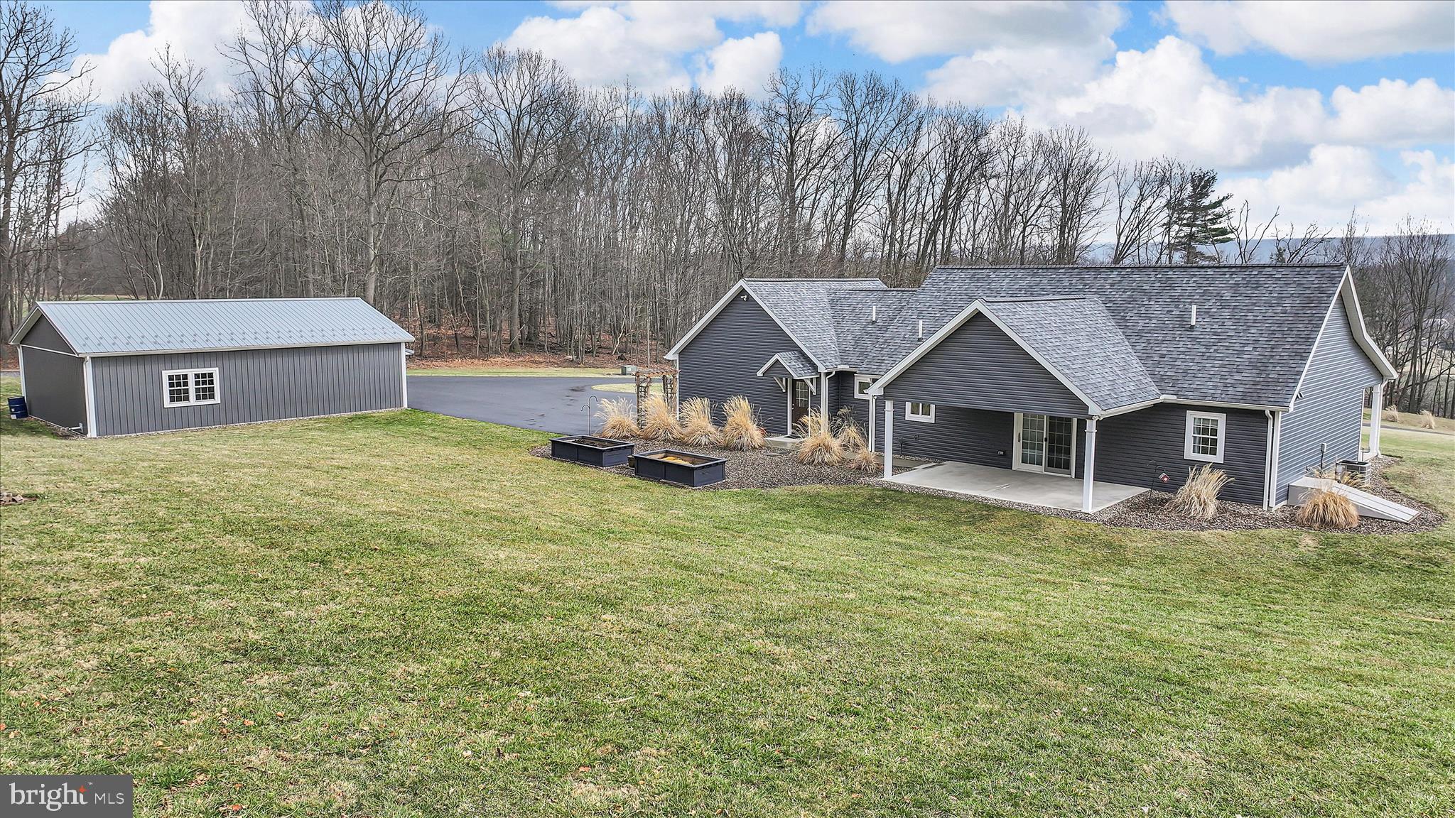 643 Deturksville Road Pine Grove, PA 17963 - Photo 9 of 59 a front view of house with yard and trees in the background