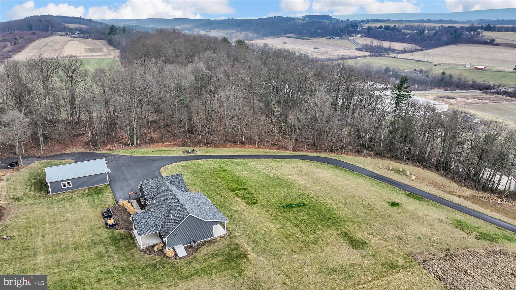 643 Deturksville Road Pine Grove, PA 17963 - Photo 10 of 59 an aerial view of a house with a yard and lake view
