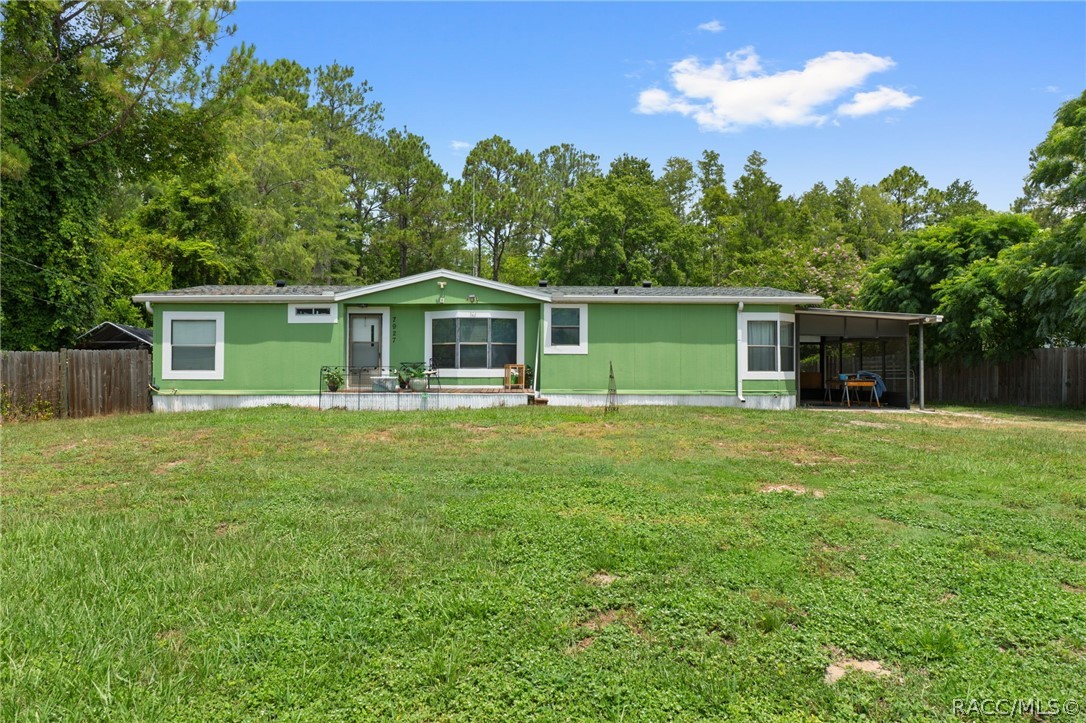 7927 West Cyprian Court Homosassa, FL 34448 - Photo 1 of 40 a front view of house with yard and green space