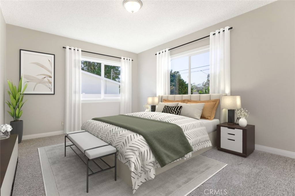 10404 Leolang Avenue Sunland, CA 91040 - Photo 10 of 37 a bedroom with a bed table and a window