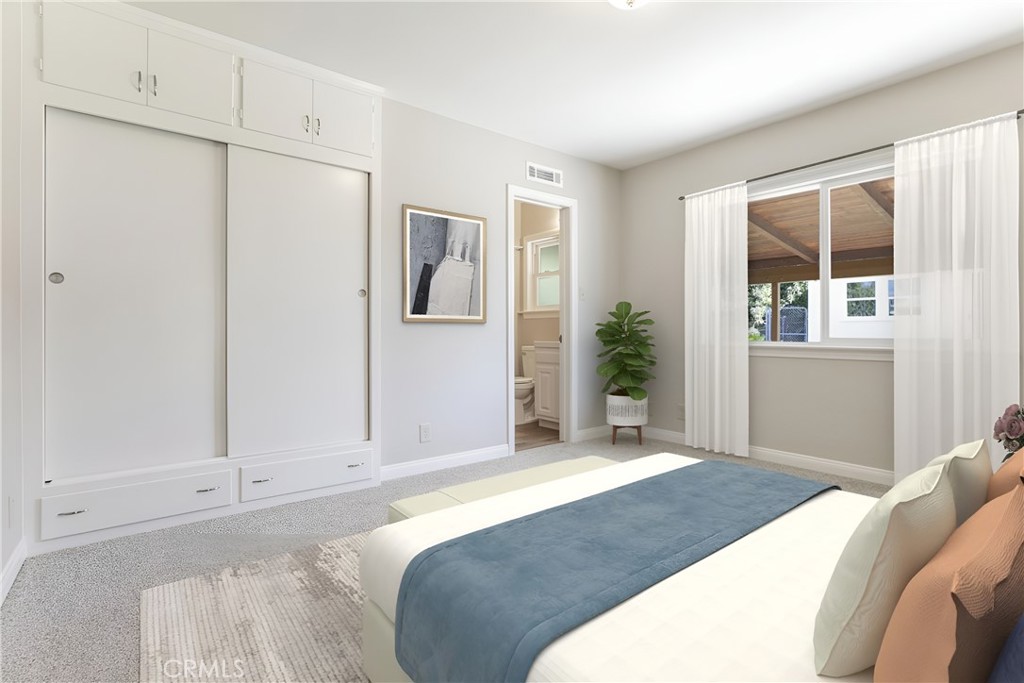 10404 Leolang Avenue Sunland, CA 91040 - Photo 11 of 37 a bedroom with a bed and a window