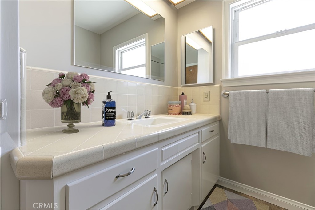 10404 Leolang Avenue Sunland, CA 91040 - Photo 12 of 37 a bathroom with a sink mirror and vanity