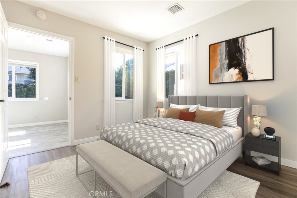 10404 Leolang Avenue Sunland, CA 91040 - Photo 19 of 37 a bedroom with a bed and a painting on the wall