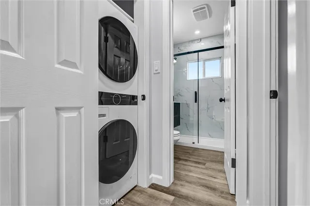 a view of a hallway with washer and dryer
