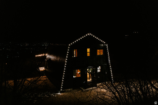 1413 Basel Drive Midway, UT 84049 - Photo 121 of 137 Back of house at twilight with a gambrel roof and a patio area