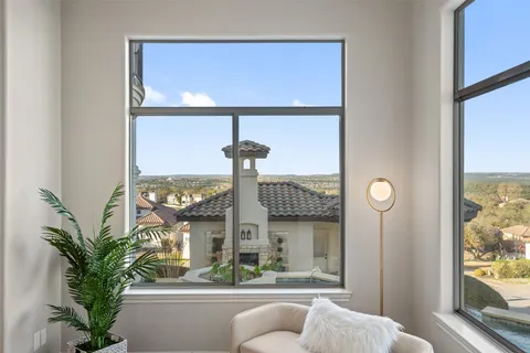 a view of balcony with furniture