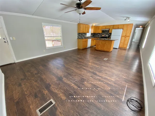 a view of kitchen and dining room with wooden floor
