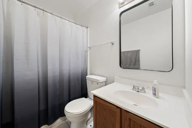 a bathroom with a sink double vanity and a mirror