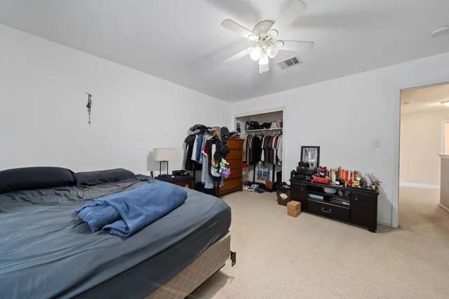 a bed room with furniture and a window