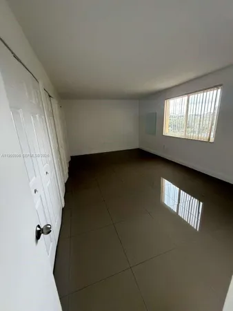 an empty room with a door