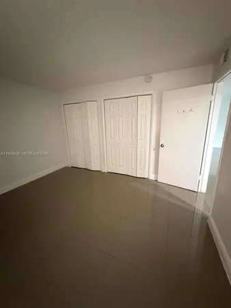 a view of a room with a large window