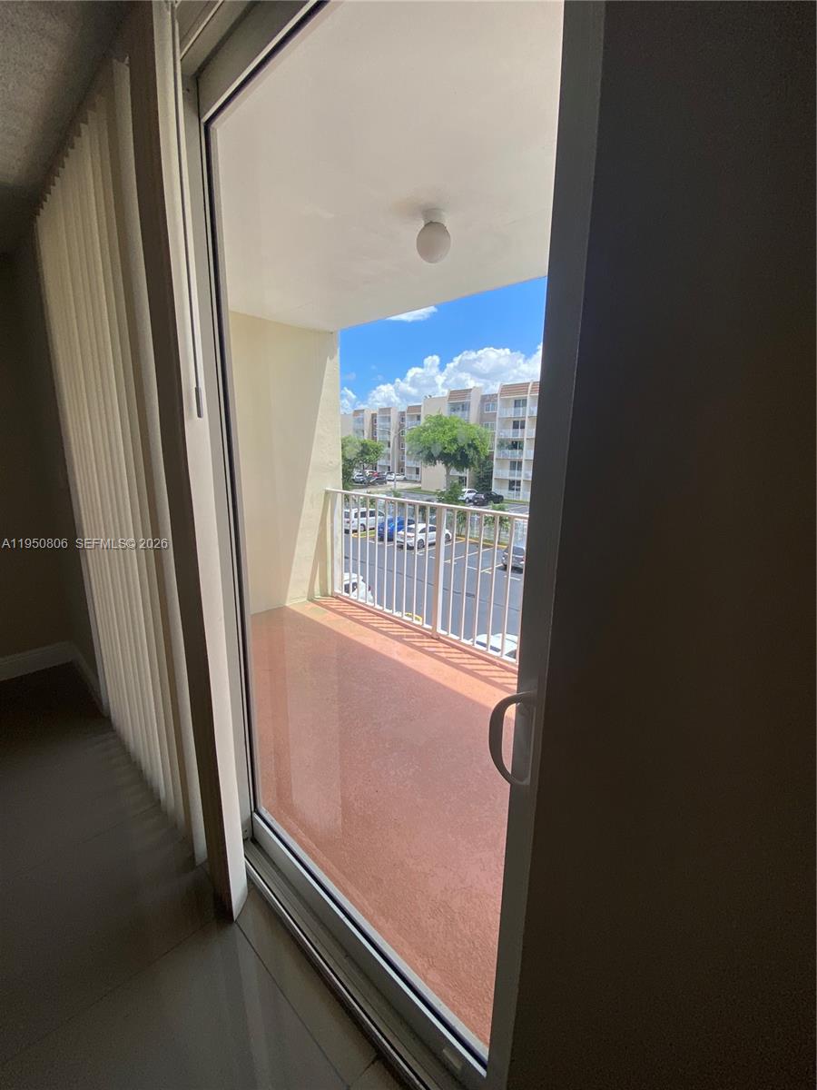 6980 Northwest 186th Street, Unit 3321 Hialeah, FL 33015 - Photo 10 of 10 a view of a room with a large window