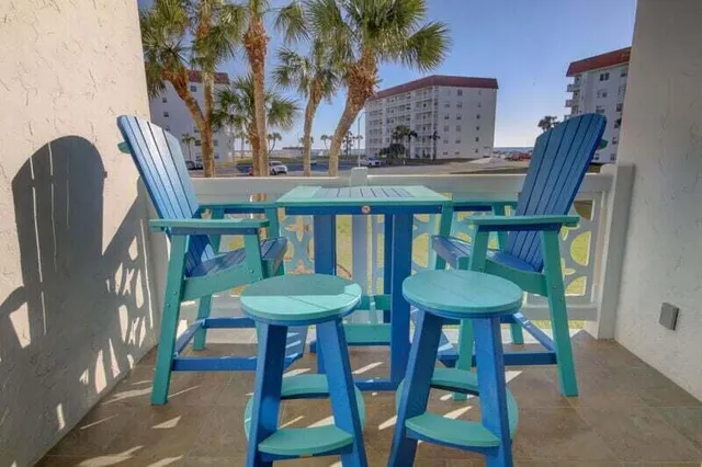 a view of a chairs and table in a patio